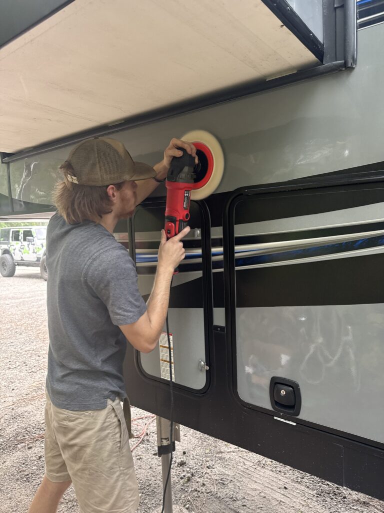 Aerial view of a car being detailed, showcasing the mobile detailing service Jacksonville FL in action.