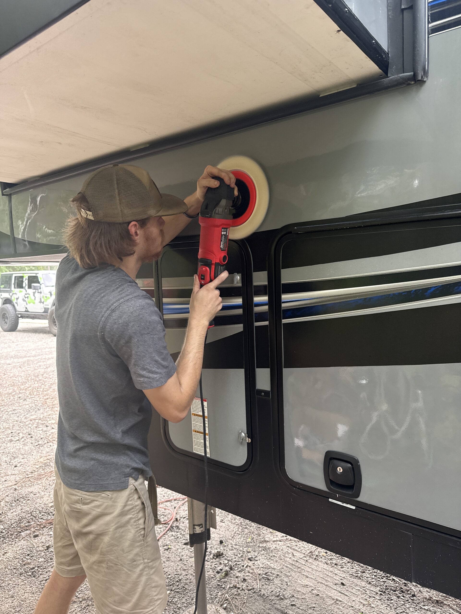 Aerial view of a car being detailed, showcasing the mobile detailing service Jacksonville FL in action.