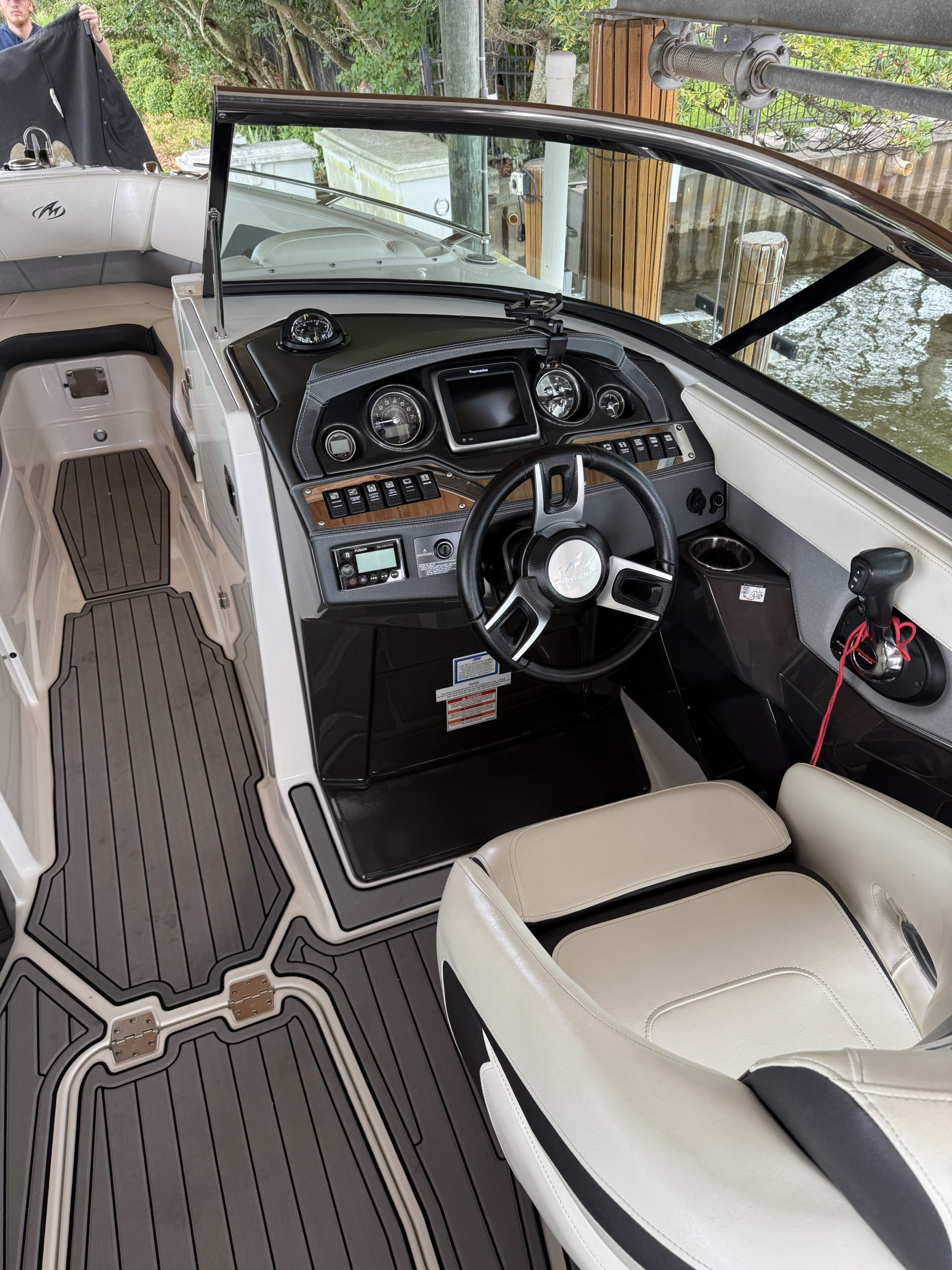 A clean car exterior shines under sunlight, showcasing the results of a mobile detailing service Jacksonville FL.