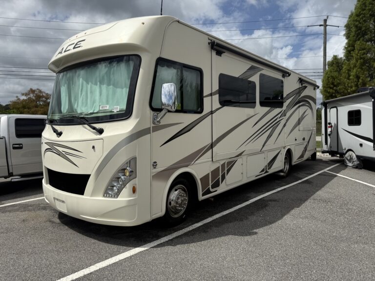A detailed view of a shiny car hood reflecting light, showcasing expert detailing work at Moran's Performance Detailing.