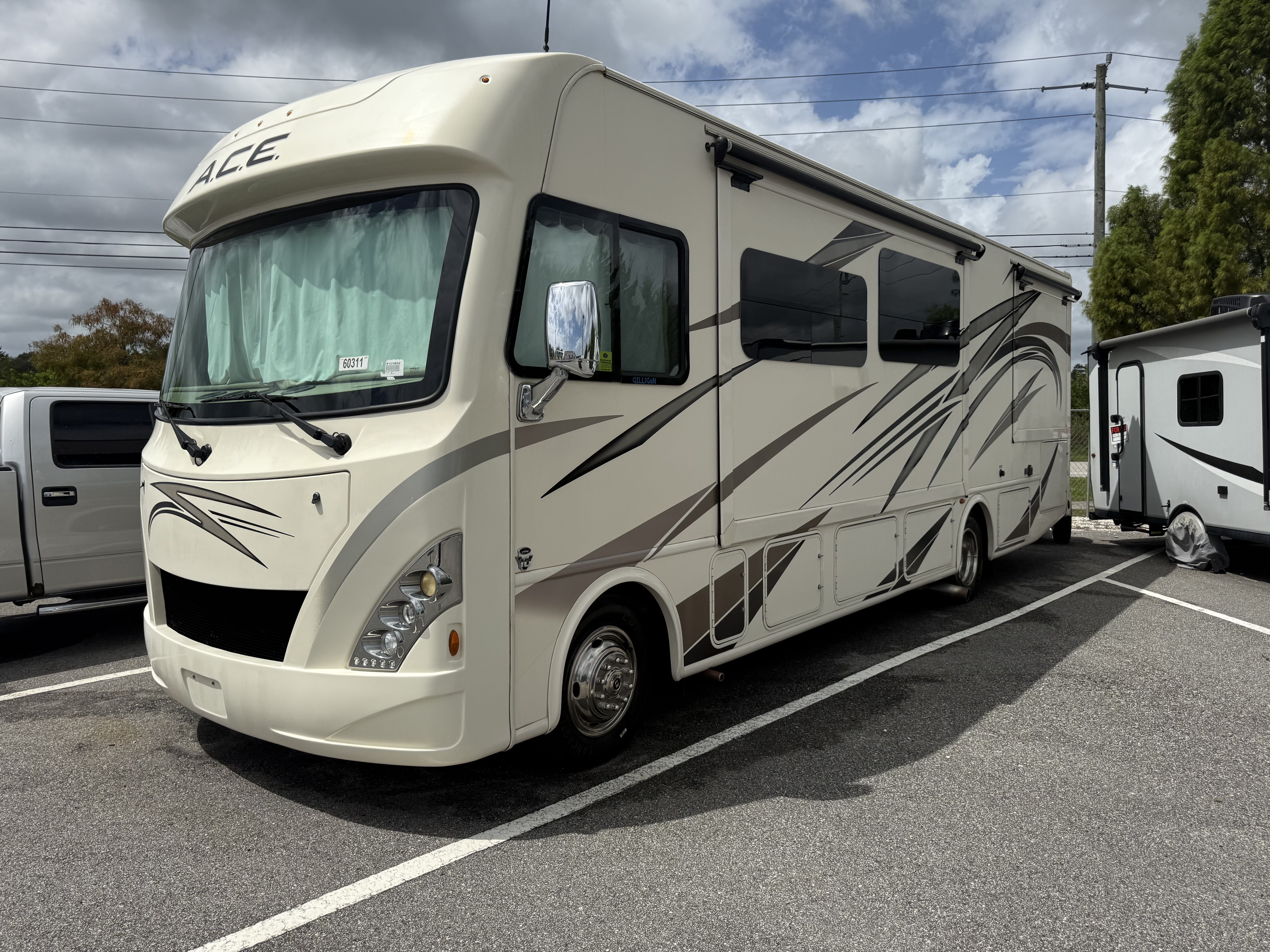 A detailed view of a shiny car hood reflecting light, showcasing expert detailing work at Moran's Performance Detailing.