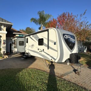 A detailed aerial view of a car's exterior showcasing its shine and detailing work, highlighting Moran's Performance Detailin