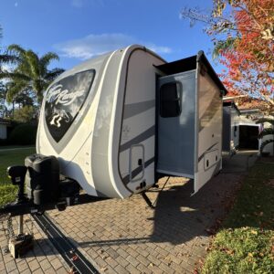 A high-resolution aerial view of a car's shiny surface, showcasing detailed reflections and vibrant colors.