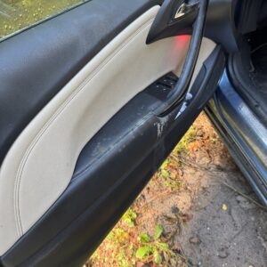 A close-up of a shiny car hood reflecting sunlight, showcasing a detailed car detailing service.