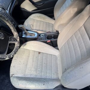 A close-up of a shiny, detailed car hood reflecting light, showcasing Moran's Performance Detailing services.