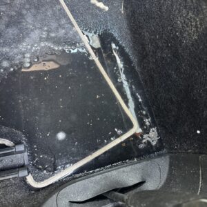 A detailed view of a polished car's surface showcasing reflections and shine, emphasizing quality detailing work.