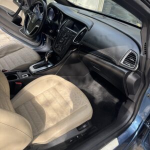 A detailed view of a car's shiny exterior after a professional detailing service, showcasing the reflective surface.