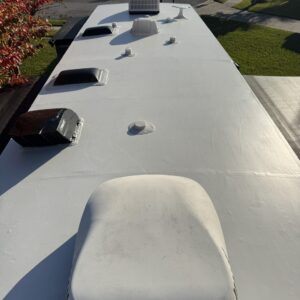 A detailed view of a shiny car hood showcasing a flawless paint finish, highlighting Moran's Performance Detailing services.