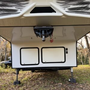 A detailed view of a shiny car's surface reflecting light, showcasing the results of professional detailing.