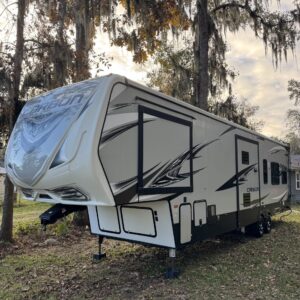 A close-up view of a shiny, well-polished car hood reflecting light, showcasing meticulous detailing work.
