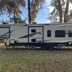 A detailed view of a shiny car's hood reflecting the surroundings, showcasing Moran's Performance Detailing services.