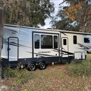 A close-up view of a shiny, detailed car surface showcasing high-quality paintwork and reflections.