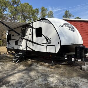 A detailed view of a shiny, well-polished car hood reflecting light, showcasing a professional detailing service.