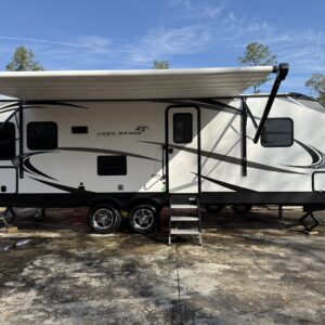 A detailed view of a shiny car hood reflecting light, showcasing the quality of Moran's Performance Detailing services.