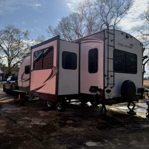 A detailed view of a freshly polished car hood reflecting light, showcasing the shine and clarity of the paint.