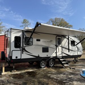 A detailed view of a polished car exterior showcasing a glossy finish, highlighting Moran's Performance Detailing services.