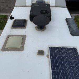 A detailed view of a polished car exterior, showcasing a glossy finish and reflections, highlighting Moran's Performance Deta