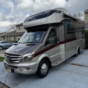 A detailed view of a shiny car hood reflecting light, showcasing the quality of Moran's Performance Detailing services.