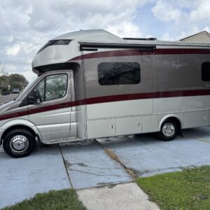 A detailed view of a shiny, well-polished car surface reflecting light, showcasing professional detailing work.