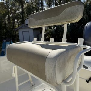 A detailed view of a polished car hood reflecting sunlight, showcasing the high-quality detailing work.