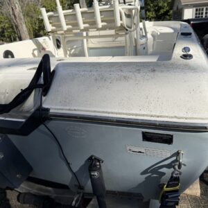 A detailed view of a shiny car hood reflecting the surrounding environment, showcasing a professional car detailing service.