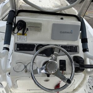 A close-up view of a shiny, detailed car hood reflecting light, showcasing the quality of Moran's Performance Detailing servi