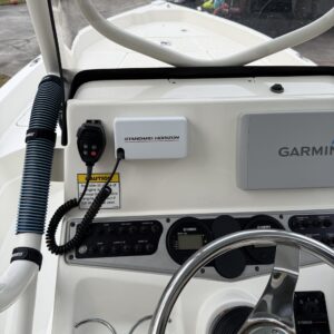 A detailed view of a shiny car surface reflecting light, showcasing a professional detailing finish.