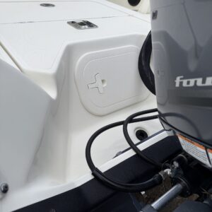 A detailed view of a shiny car hood reflecting light, showcasing the quality of Moran's Performance Detailing services.