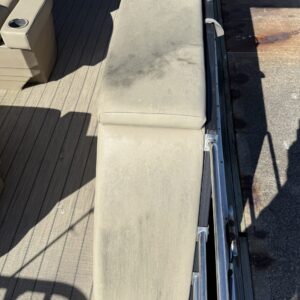 A close-up of a shiny car hood reflecting light, showcasing a detailed car detailing service.