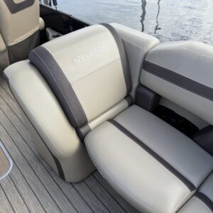 A close-up of a detailed car surface showing a glossy finish and reflections, highlighting the quality of performance detaili