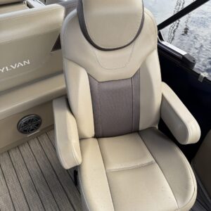 A detailed view of a shiny car hood reflecting light, showcasing the quality of Moran's Performance Detailing services.