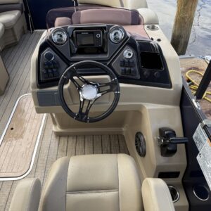 A detailed view of a shiny car hood reflecting light, showcasing the quality of Moran's Performance Detailing services.