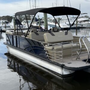 A detailed view of a shiny, well-polished car hood reflecting light, showcasing Moran's Performance Detailing expertise.